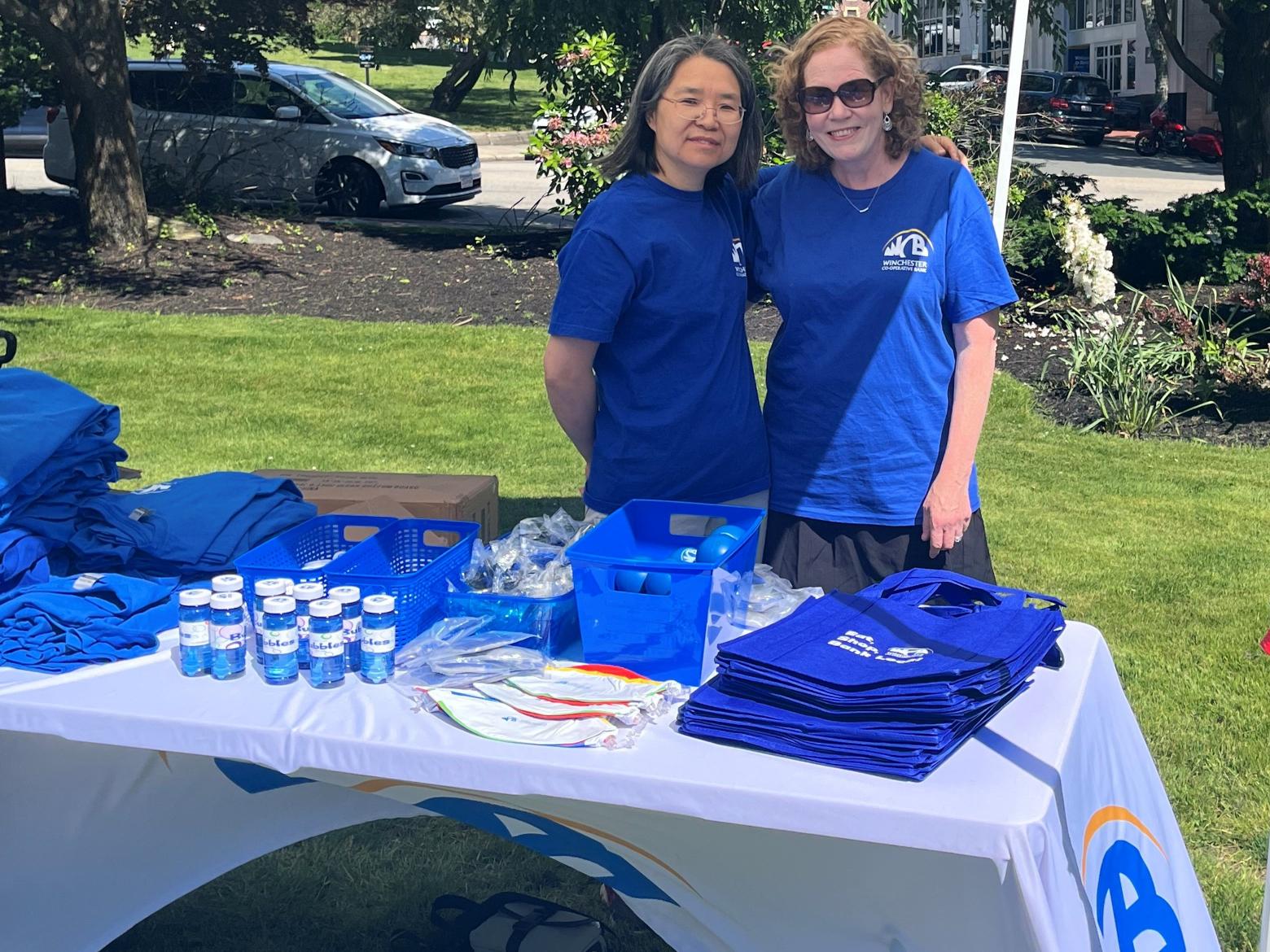 Fran and Julie at table with giveaways