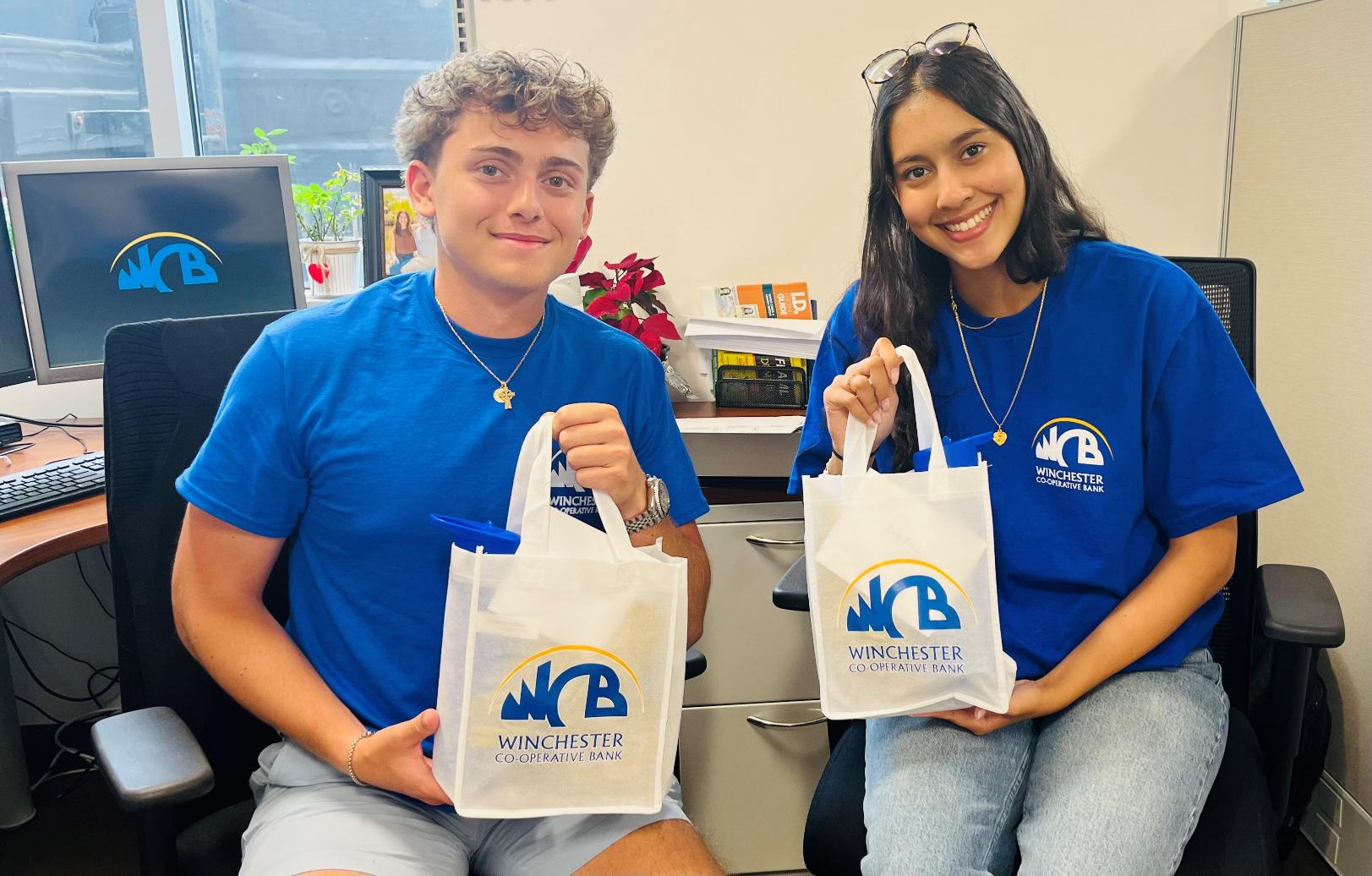 interns holding bags