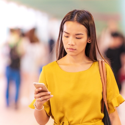 woman holding phone