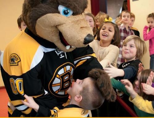 bruins bear surrounded by children