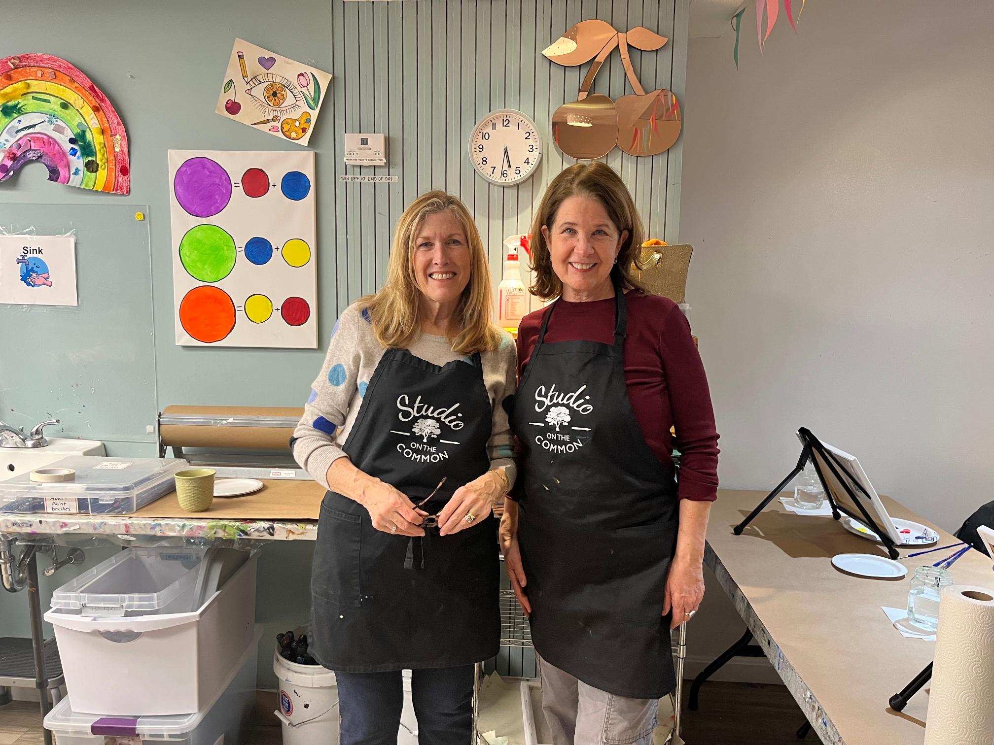 two woman with  smocks 