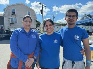 three people in blue WCB shirts